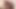 The elderly couple engaged in sexual intercourse while seated on the sofa inside the living room.