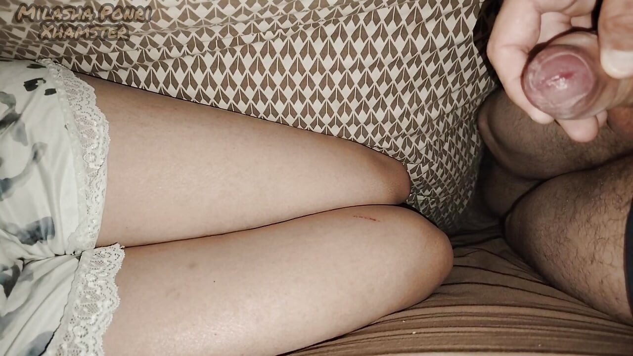I'm lying next to my stepsister and touching my dick.