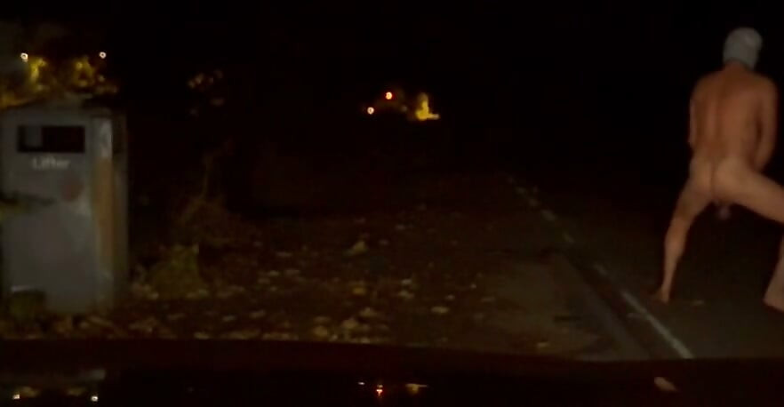 Interrupted while cutting off clothes , had to hide infront of car crouched down till car passed
