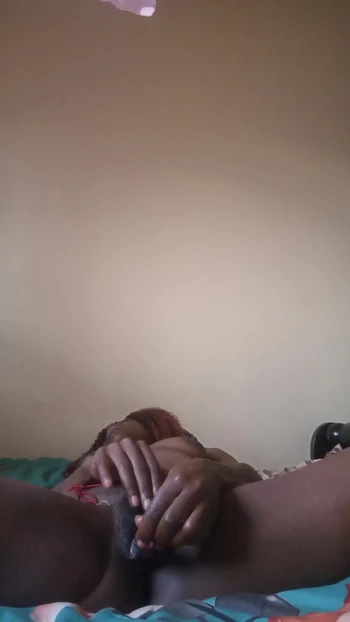 Key moment from "Candy27 fucking her self with sex toy while wearing waite waisted bead."
