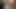 彼女の足が彼の顔に当たり、手コキをしている