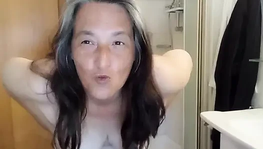 Mature voluptuous woman shows off her wet curves