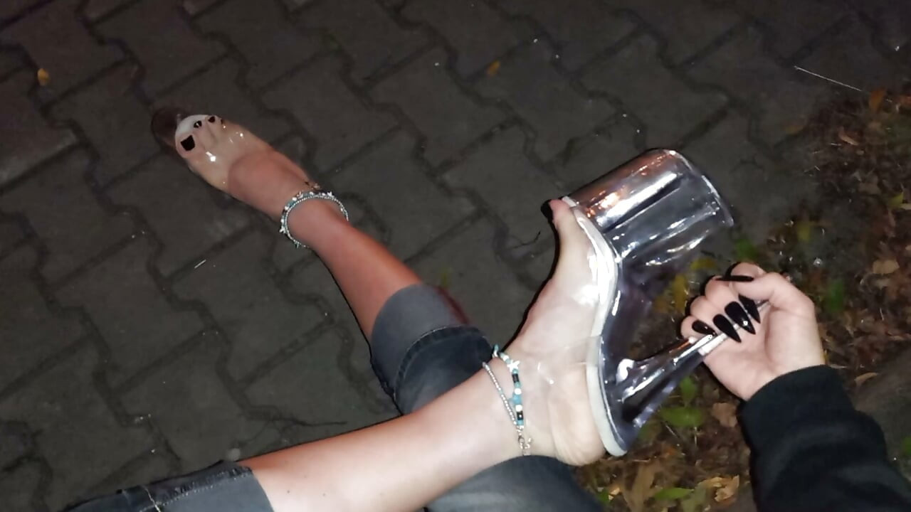 nighttime crossdressing on a public street in 20cm stripper heels, black toes, and black claws