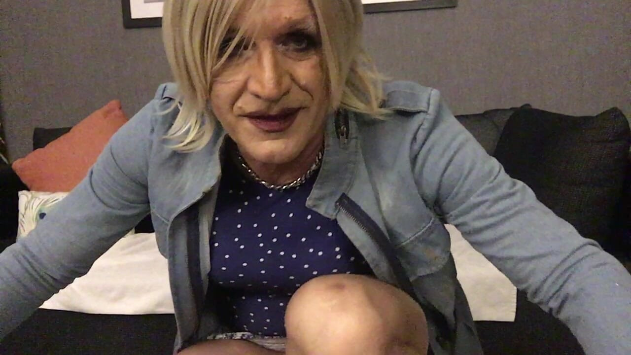 Tranny spreading pantyhose legs in  blue tight minidress and denim jacket