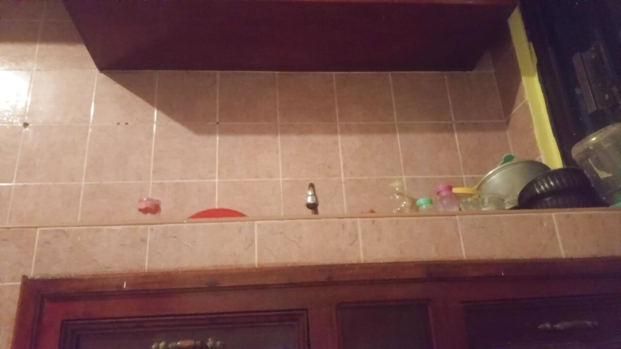 Chubby mom in the kitchen showing thong