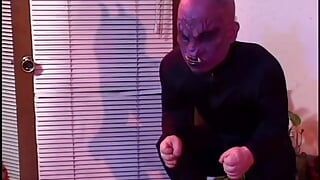 Masked man is on his knees eating out her pussy