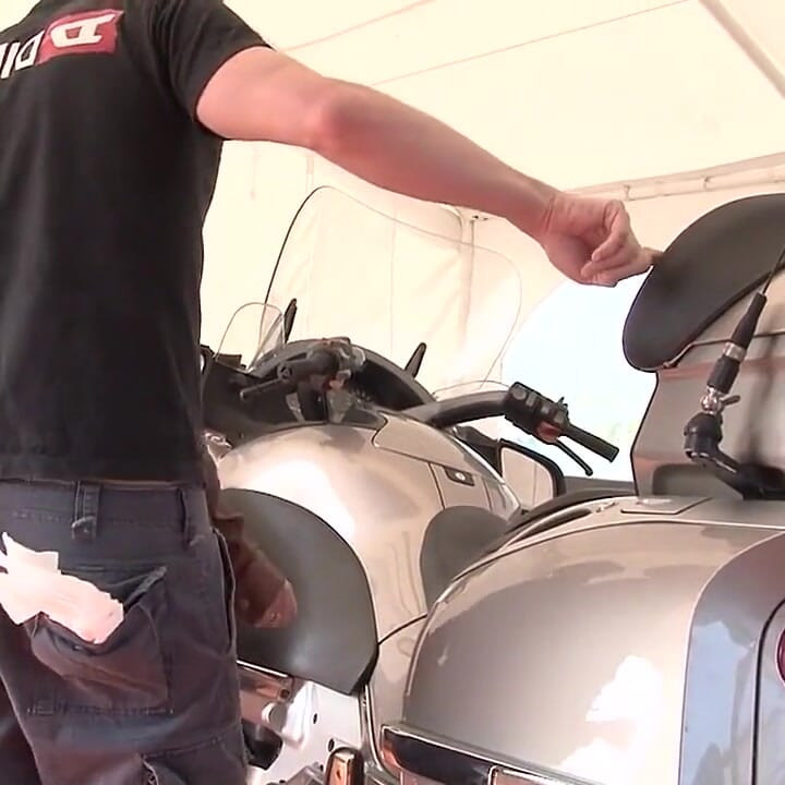Horny brunette gets fucked on motorcycle