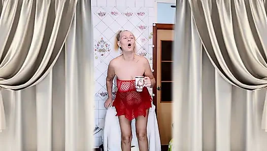 Hot housewife Lukerya flirts over morning coffee in a red mesh dress.