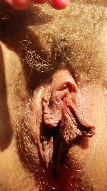 Memorable moment from "Closeup hairy huge pussy and long labia rubs her big clit and cums for you"