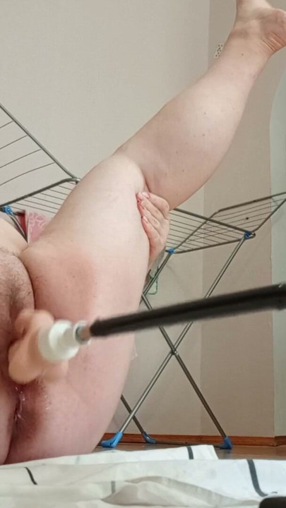 Mother-in-law with big hairy pussy gets a big squirt from a sex machine | Clip 1
