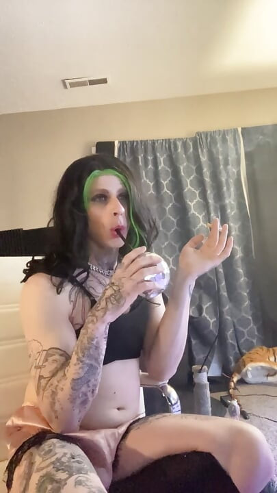Sexy crossdresser smokes