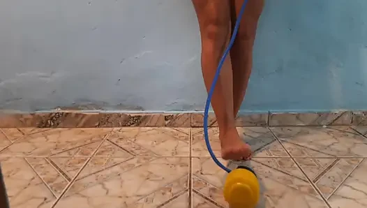She exhibited off her beautiful body and feet, inflating the condom by stepping on the foot pump.
