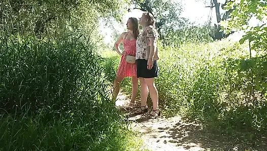 Two women girl and mature milf took off red panties peeing on side of road in public Pee Outdoor Outside  Lesbians kiss