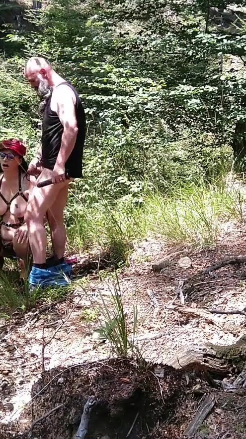 Milf woman with big tits jerking fat dick in the woods | Clip 1