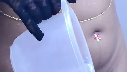 Young girl stripping and taking bath