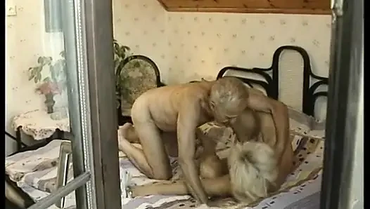 Hairy blonde mature gets spitroasted in a threesome