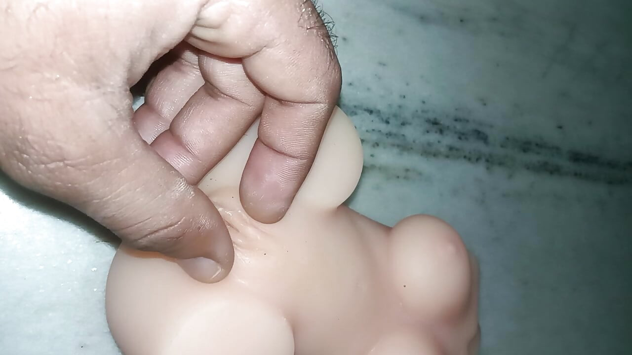 Boy play with sex doll boobs