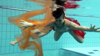 Two underwater girls loving eachother