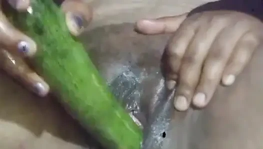Today, Indian bhabhi quenched her desire by inserting a cucumber into her pussy.