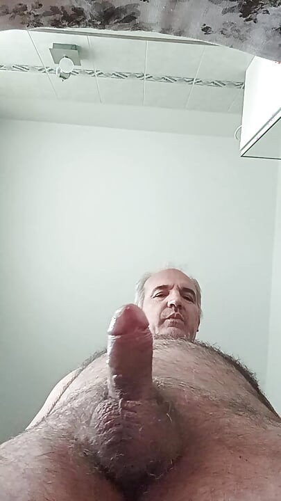 Handledning för en trevlig penismassage med ett flöde av spermier på smartphoneskärmen