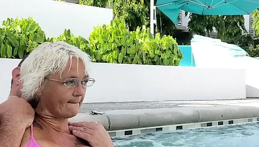 Getting frisky in the hot tub. Boob play.