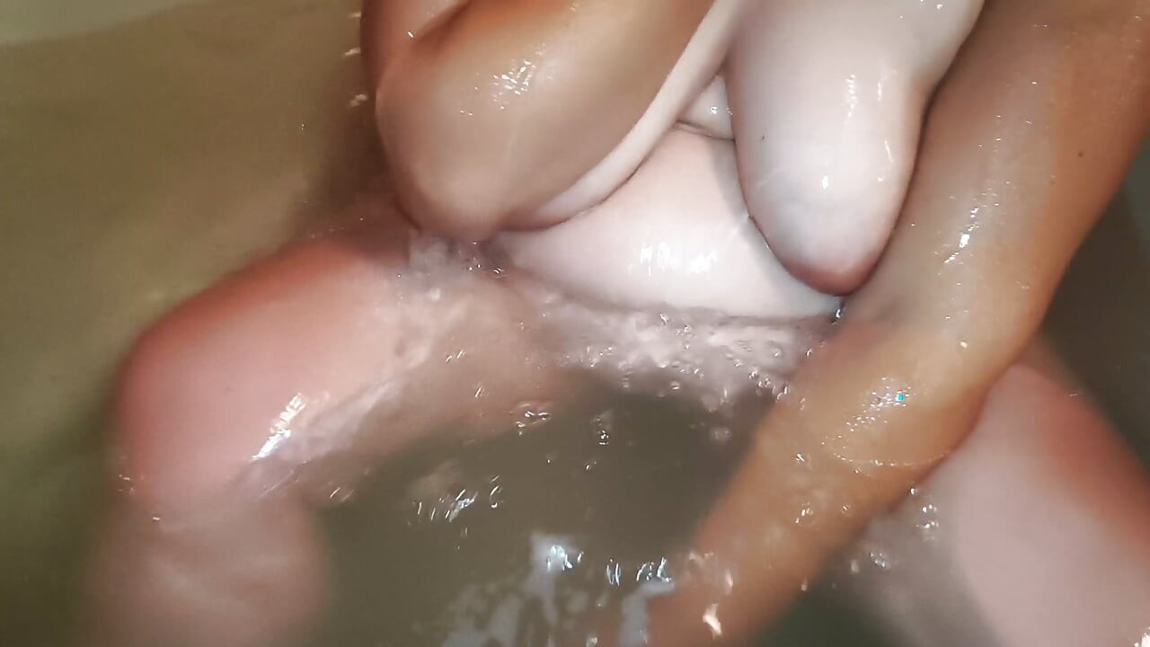 Huge wet breasts in the bathtub - kneaded and shown by hand