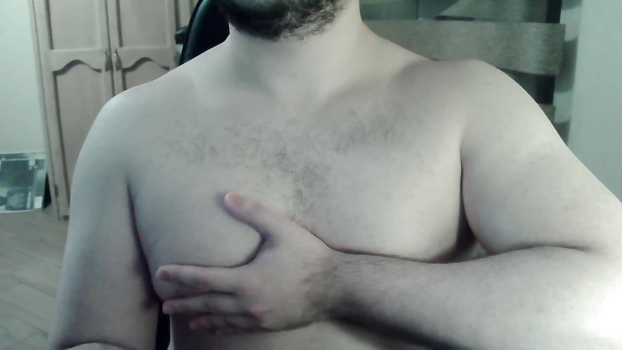 Hot beefy camboy shows off the goods during a show