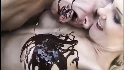Kinky dude and blonde MILF fuck while being covered in chocolate syrup