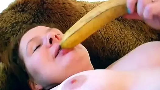 A hot German BBW enjoys rubbing her shaved twat on the bed