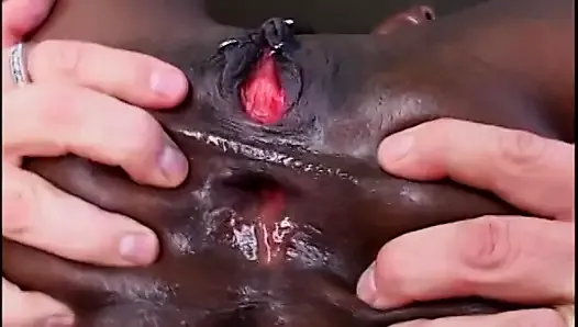 Ebony slut has two white cocks filling up her holes
