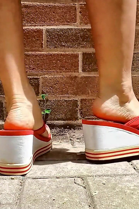 Small Asian Feet in Red Heeled Flip Flops