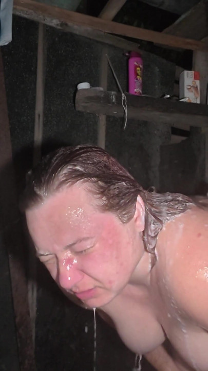 Golden shower at night in an outdoor shower | Clip 1