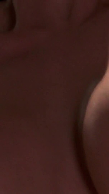 Key moment from "Brunette gets her huge perky tits jizzed on after doggy fucking"
