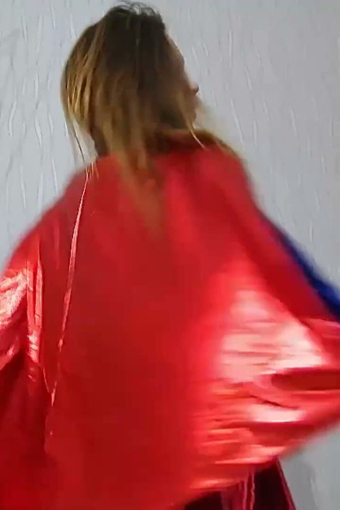 Beautiful babe in superman costume is dildoing her pussy