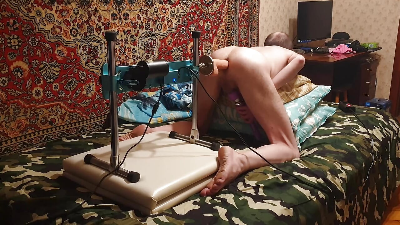 Hot gay having sex with a fuck machine