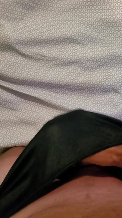 Masterbating in black nylon panties.