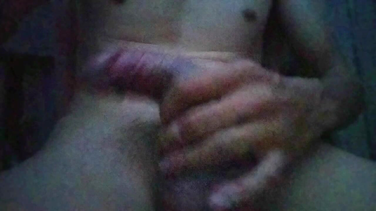 Young man plays with his big cock