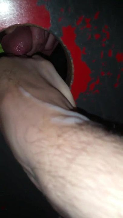 Glory hole footjob cum
