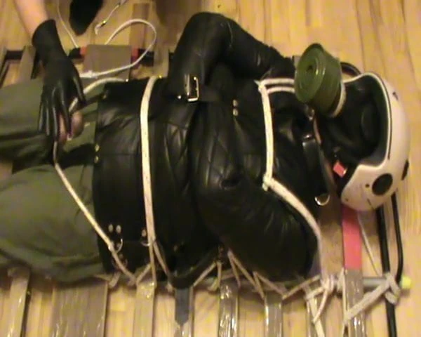 Restrained in a straitjacket and ect.