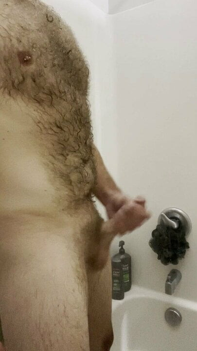 Stroking cock in the shower