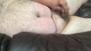 Uncut Bear Naked on the couch cumming