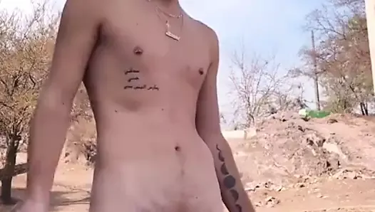 Hot young guy jerking outside