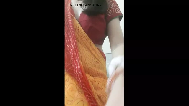 Aunty taking off yellow saree