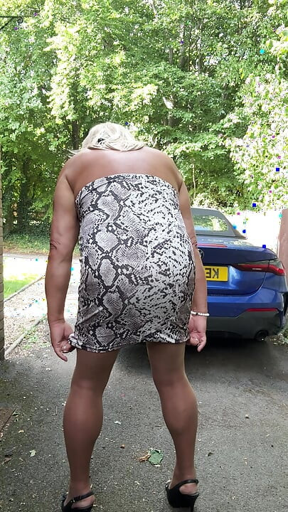 Sexy Crossdresser kellycd2022 in white animal print dress pantyhose and heels