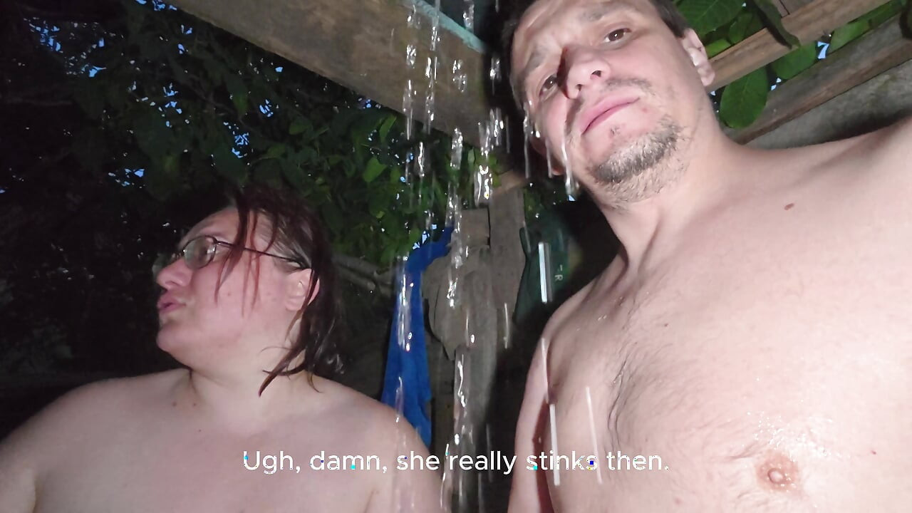Soapy naked bodies in a rural shower