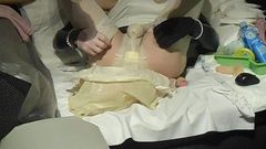 Rubber-Sissy changing her soaken diaper