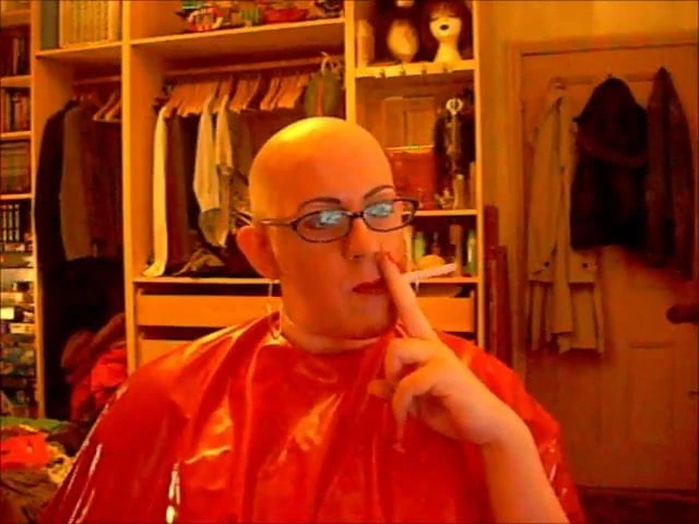Bald and smoking in rubber cape