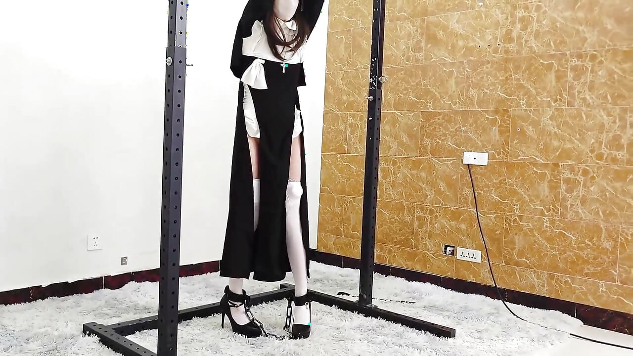 The Girlfriend Role-plays a Nun, Handcuffed and Shackled, Bound to an Iron Frame