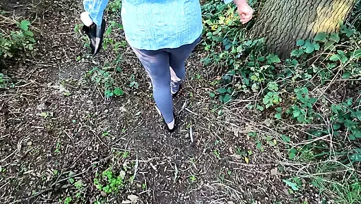 Completely naked in the field banging her breasts