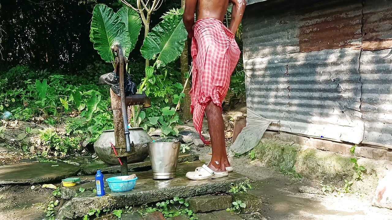Desi young man bath Open place.